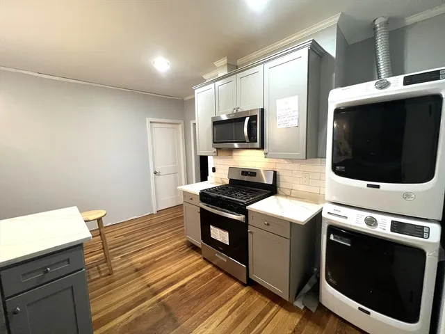a kitchen with a stove and a microwave