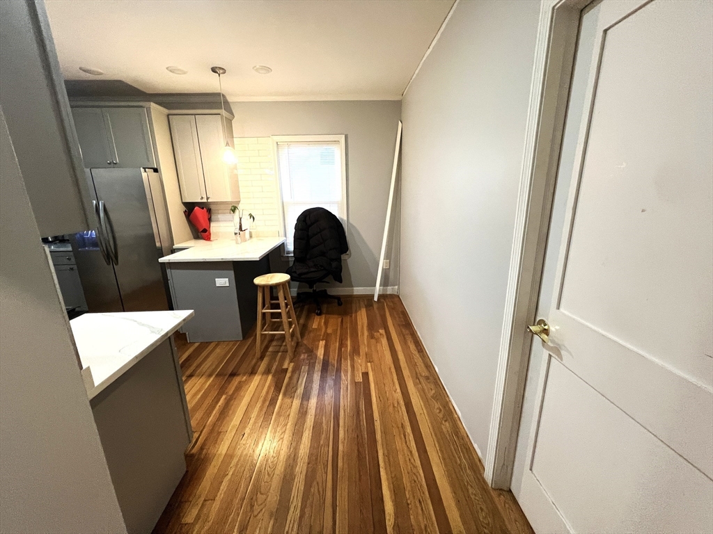 25 Teragram Street, Unit 1 Boston, MA 02128 - Photo 7 of 21 a living room with a sink and wooden floor