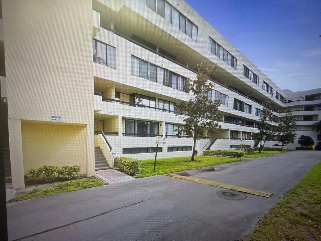 a front view of a building with street view