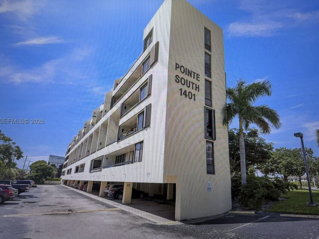 1401 South Federal Highway, Unit 102 Boca Raton, FL 33432 - Photo 11 of 38 a front view of a building with balcony