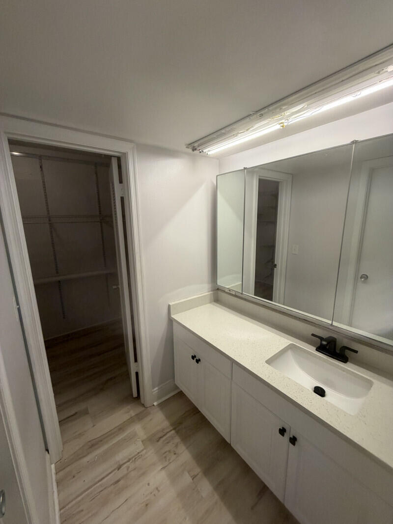 1401 South Federal Highway, Unit 102 Boca Raton, FL 33432 - Photo 14 of 38 a bathroom with a sink and a mirror