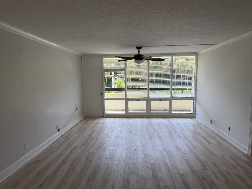 1401 South Federal Highway, Unit 102 Boca Raton, FL 33432 - Photo 22 of 38 wooden floor in an empty room with a window