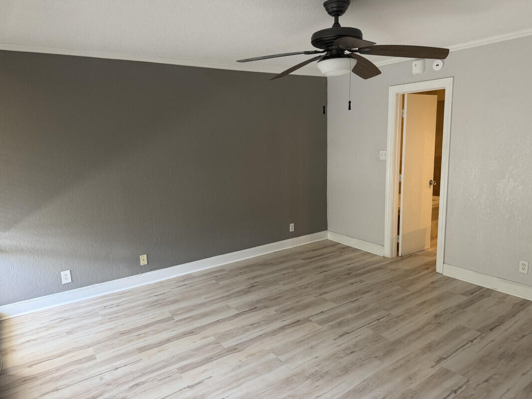 1401 South Federal Highway, Unit 102 Boca Raton, FL 33432 - Photo 25 of 38 a view of an empty room with window and a ceiling fan