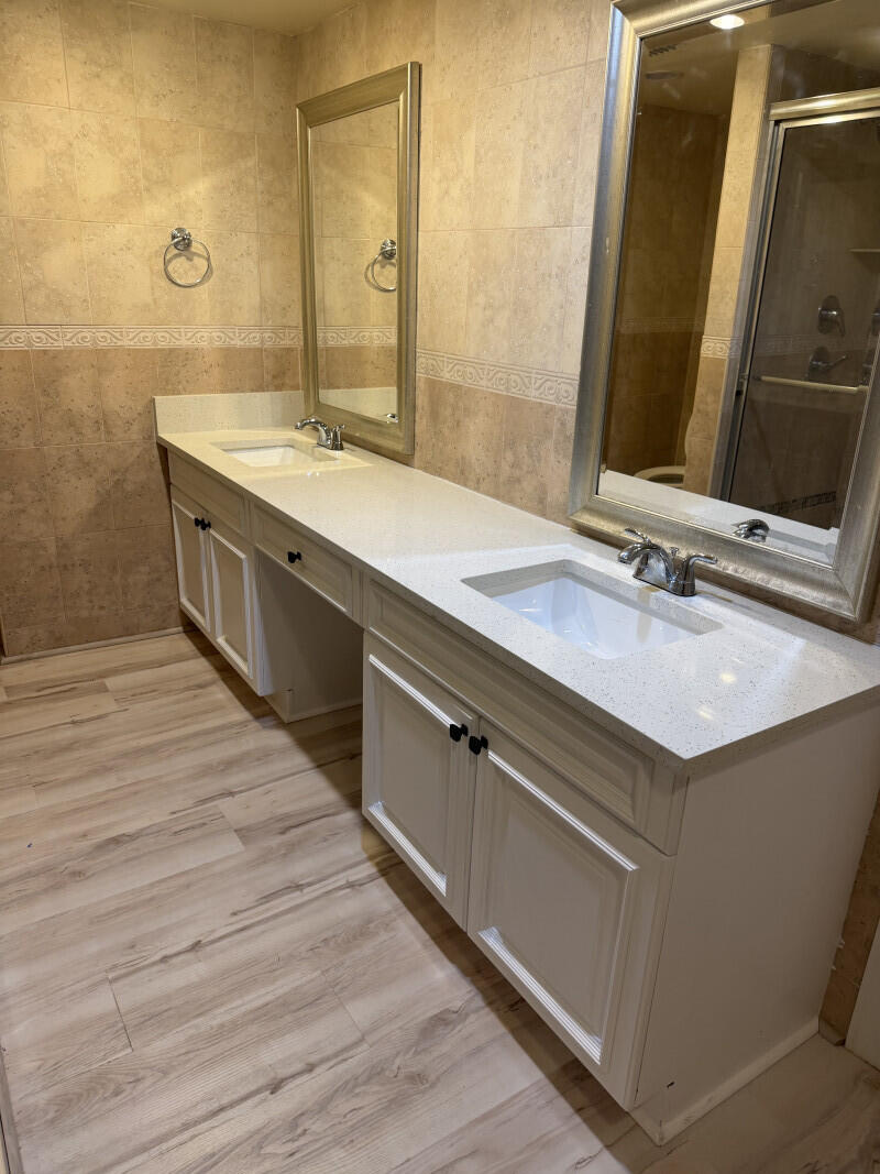 1401 South Federal Highway, Unit 102 Boca Raton, FL 33432 - Photo 27 of 38 a bathroom with a sink and a mirror