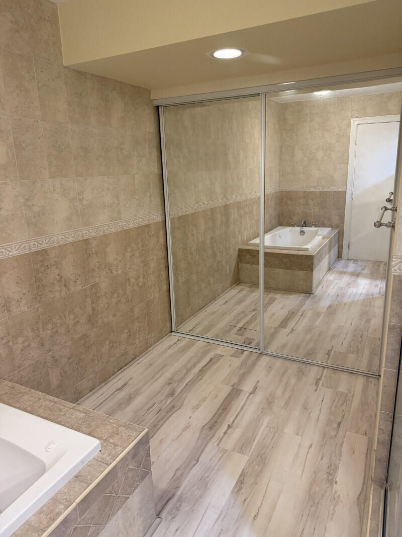 1401 South Federal Highway, Unit 102 Boca Raton, FL 33432 - Photo 28 of 38 a bathroom with a shower and a sink