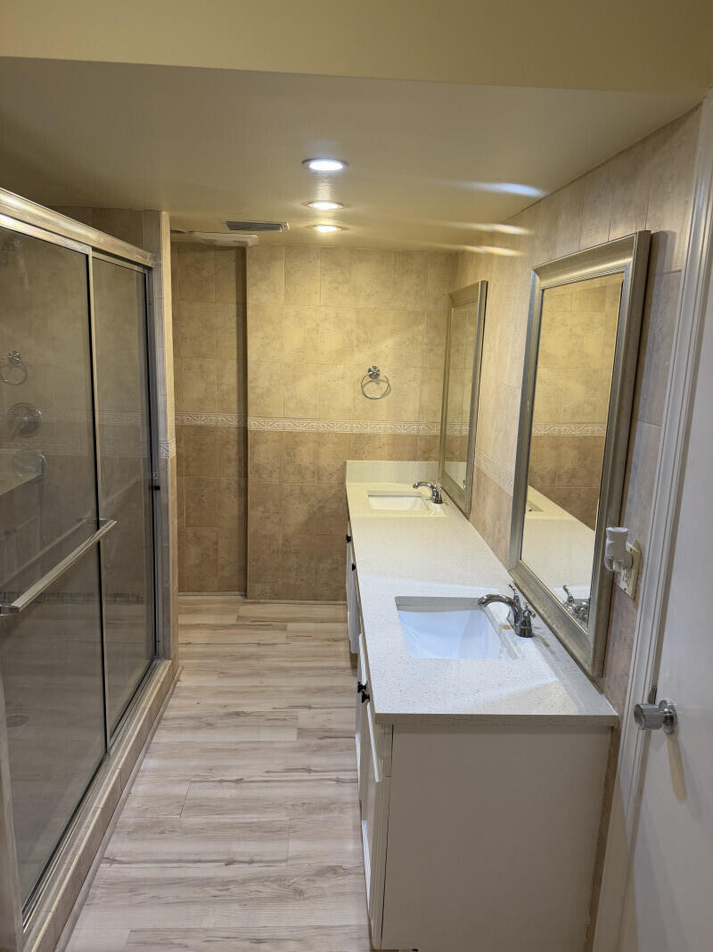 1401 South Federal Highway, Unit 102 Boca Raton, FL 33432 - Photo 30 of 38 a bathroom with a sink a toilet and shower