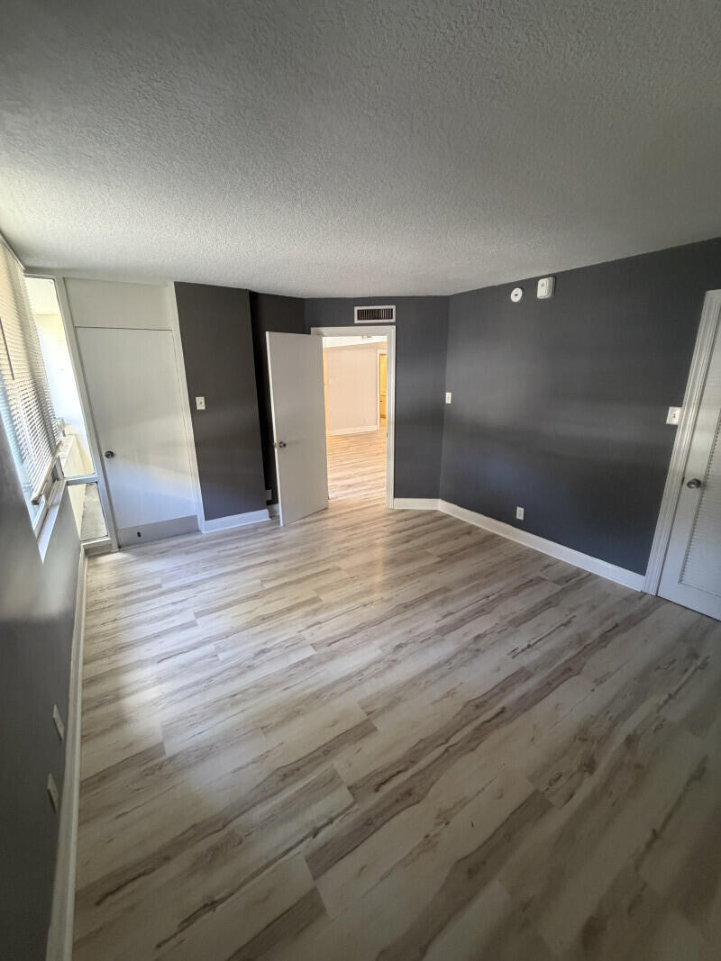 1401 South Federal Highway, Unit 102 Boca Raton, FL 33432 - Photo 35 of 38 a view of empty room with wooden floor