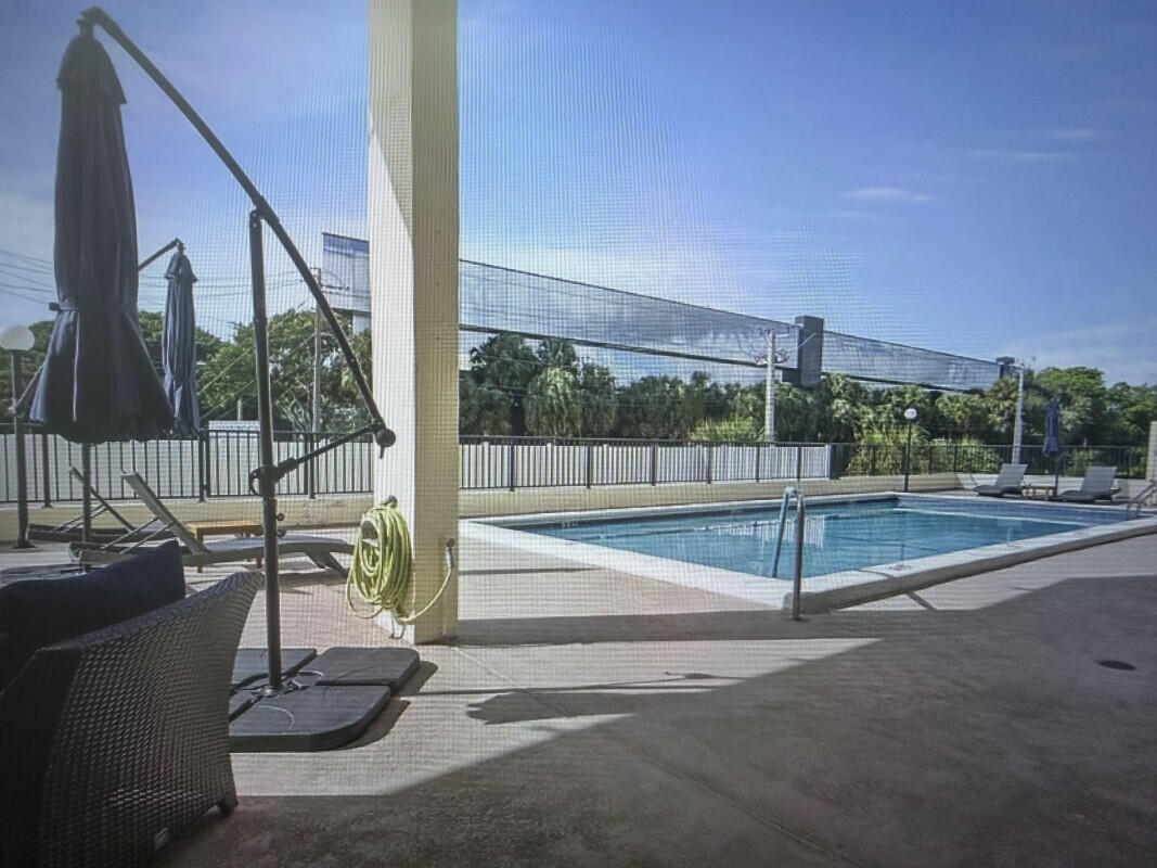 1401 South Federal Highway, Unit 102 Boca Raton, FL 33432 - Photo 37 of 38 a view of a patio with a table and chairs