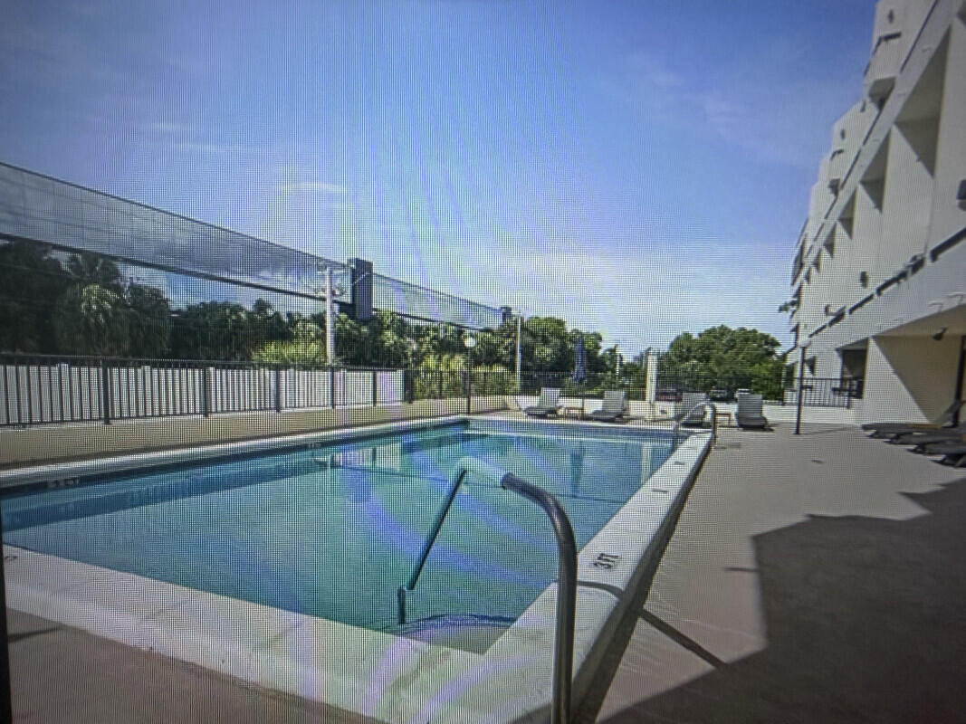 1401 South Federal Highway, Unit 102 Boca Raton, FL 33432 - Photo 38 of 38 a view of a swimming pool with a patio