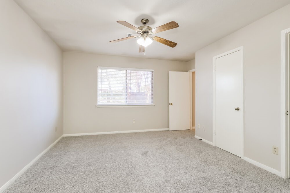 28907 Binefield Street Spring, TX 77386 - Photo 11 of 16 a view of an empty room with a ceiling fan