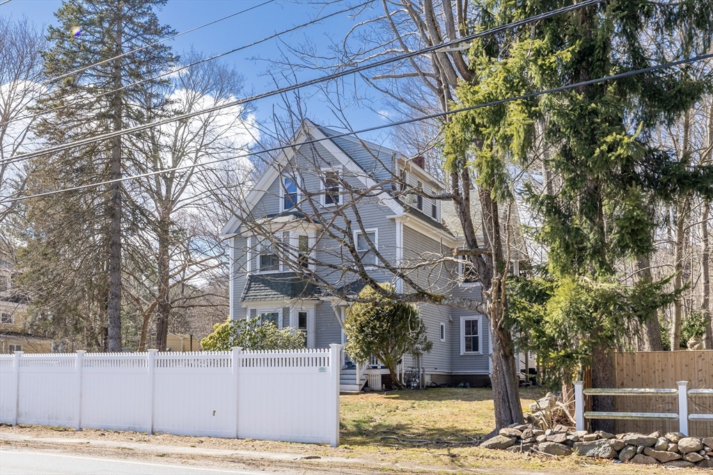 956 Bay Road, Unit 3 Hamilton, MA 01982 - Photo 1 of 30 a front view of a house with a yard