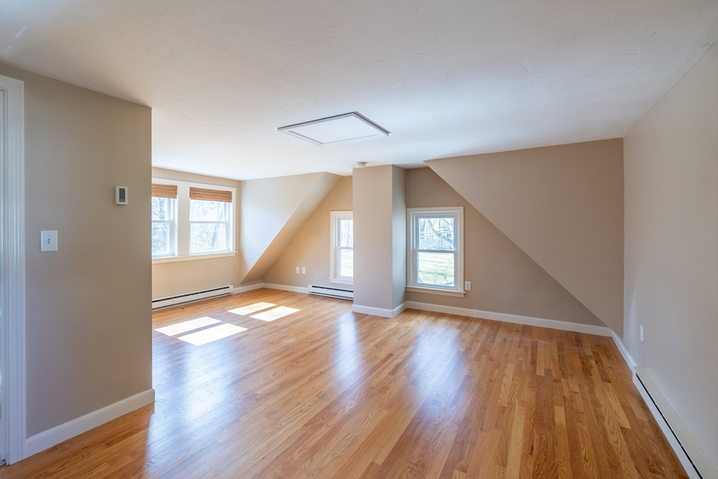 956 Bay Road, Unit 3 Hamilton, MA 01982 - Photo 14 of 30 a view of empty room with wooden floor and fan