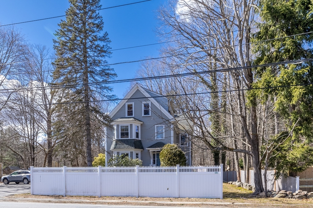 956 Bay Road, Unit 3 Hamilton, MA 01982 - Photo 2 of 30 a front view of a house with a yard
