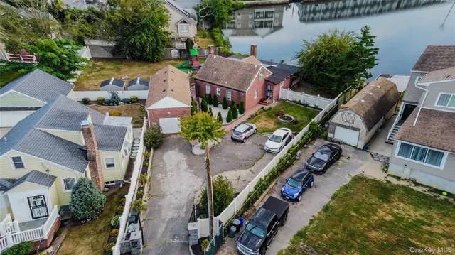 an aerial view of a house yard swimming pool and outdoor seating