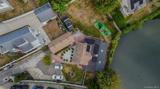 an aerial view of a house with outdoor space