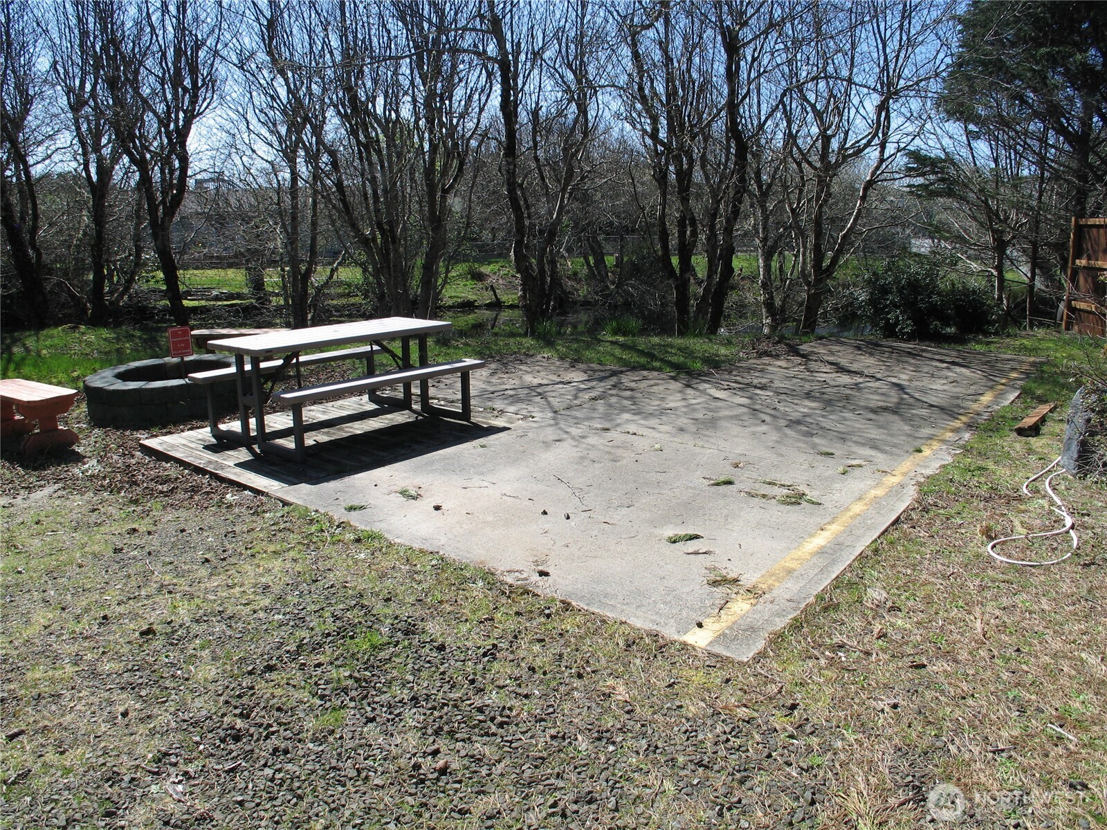 33117 H Place Ocean Park, WA 98640 - Photo 15 of 25 a view of a bench in a backyard