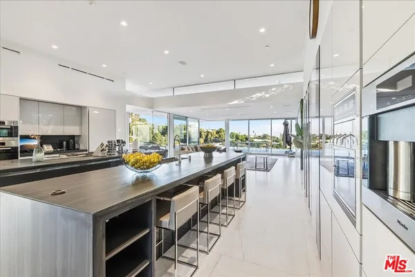 a view of a living room and balcony
