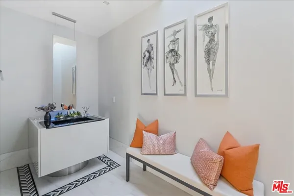 a bedroom with furniture and a wooden floor