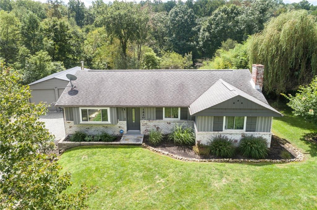 1420 Reissing Road McDonald, PA 15057 - Photo 21 of 33 This aerial view shows a home that is framed by lush greenery with a balance of open spaces and and neatly arranged shrubbery.