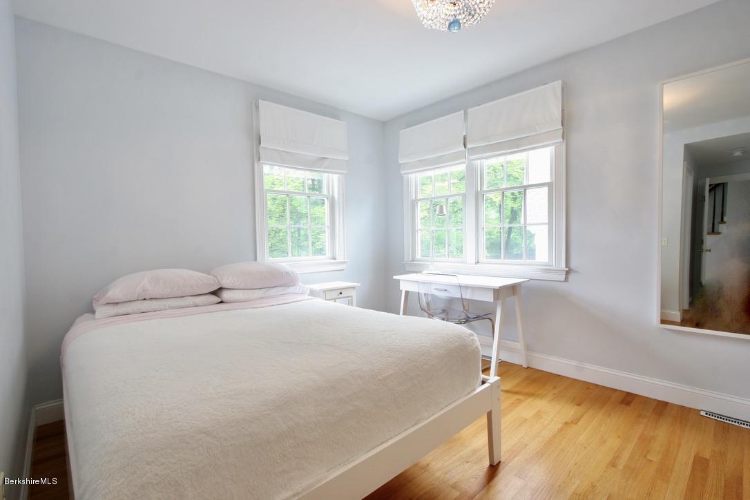 12 Prospect Hill Road Stockbridge, MA 01262 - Photo 24 of 30 a bedroom with a bed and two large window