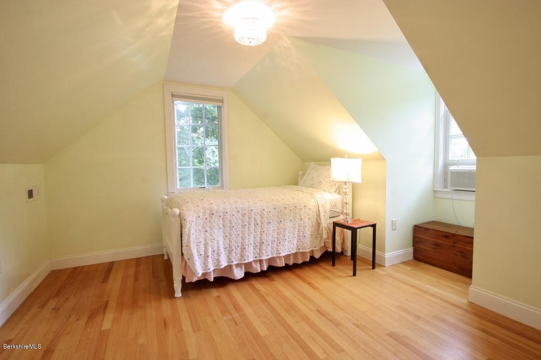 12 Prospect Hill Road Stockbridge, MA 01262 - Photo 26 of 30 a bedroom with a bed and wooden floor