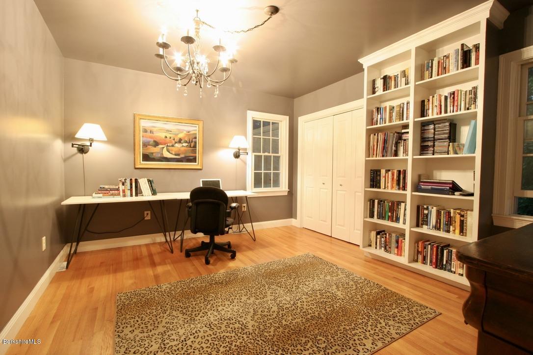 12 Prospect Hill Road Stockbridge, MA 01262 - Photo 27 of 30 a living room with fireplace furniture and a chandelier