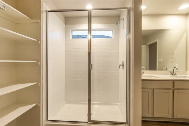 a bathroom with a granite countertop sink mirror and double