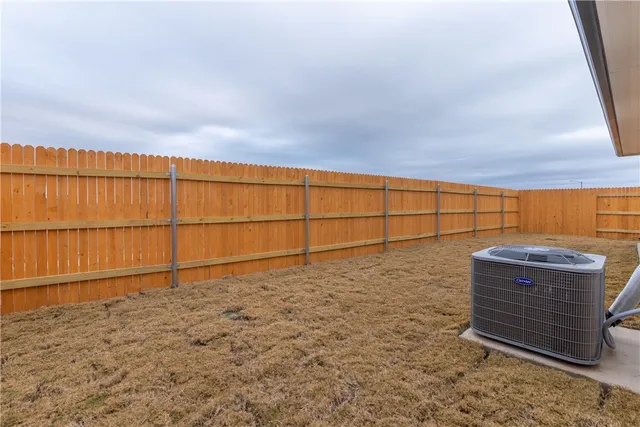 a view of house with backyard