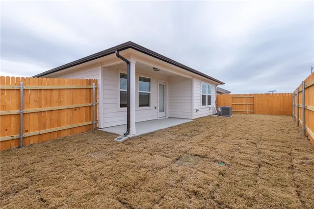 a view of outdoor space and parking area