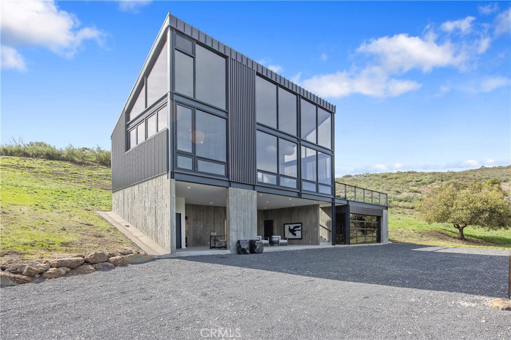 10120 Yerba Buena Road Malibu, CA 90265 - Photo 2 of 40 a view of building with yard