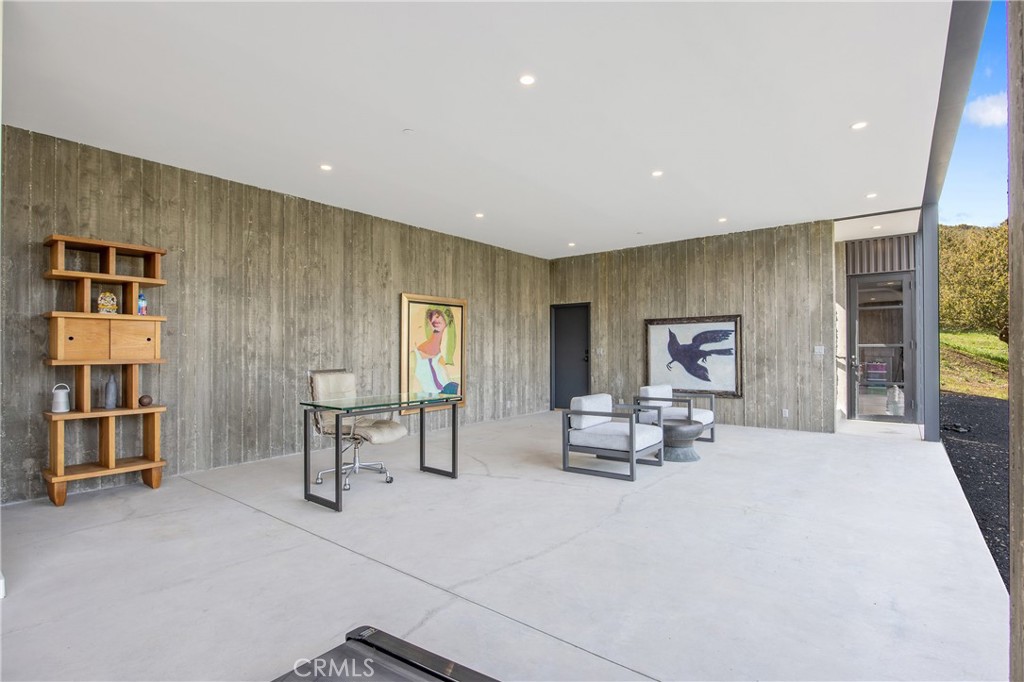 10120 Yerba Buena Road Malibu, CA 90265 - Photo 21 of 40 a living room with furniture and a table