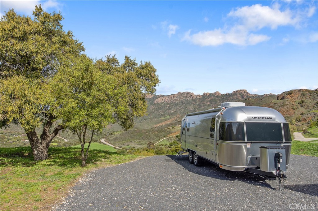 10120 Yerba Buena Road Malibu, CA 90265 - Photo 25 of 40 a view of a house with a yard