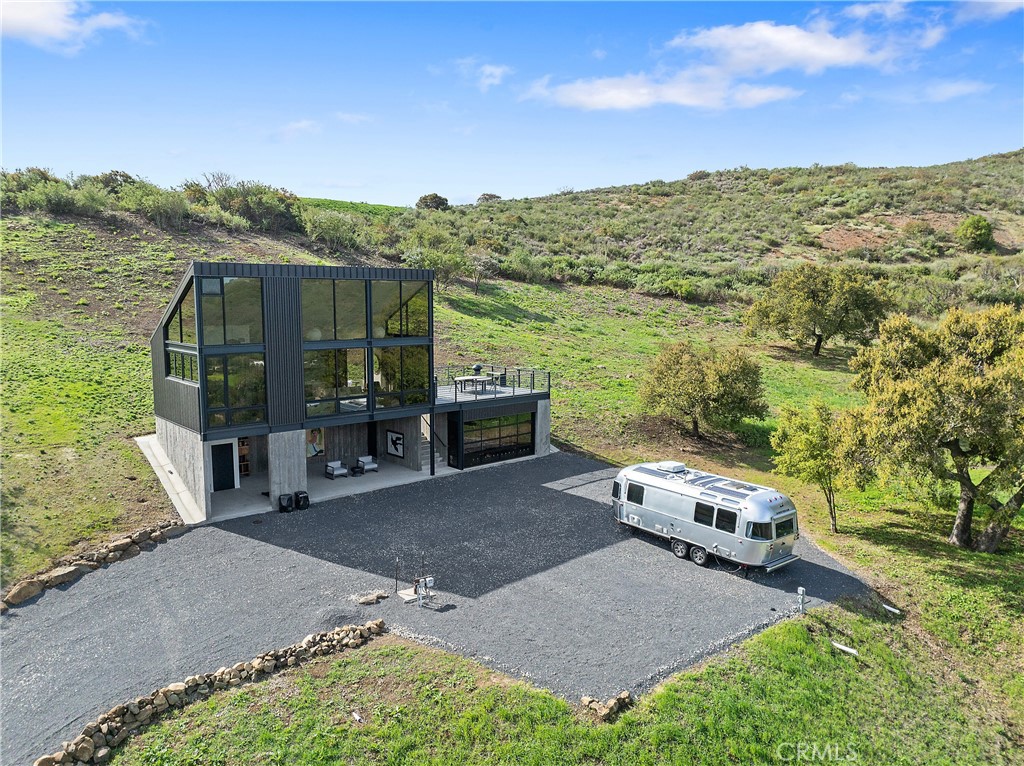 10120 Yerba Buena Road Malibu, CA 90265 - Photo 26 of 40 a view of a terrace with a garden and outdoor seating