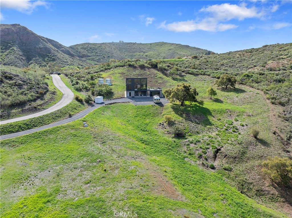 10120 Yerba Buena Road Malibu, CA 90265 - Photo 33 of 40 a view of a lush green hillside and houses