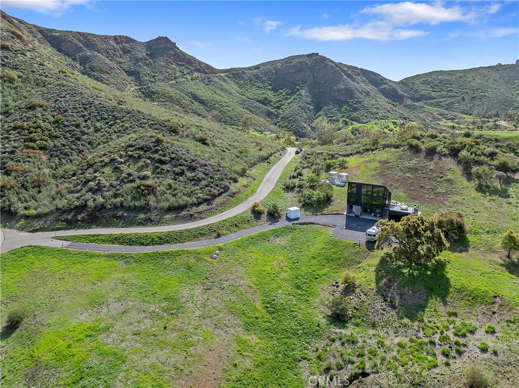 10120 Yerba Buena Road Malibu, CA 90265 - Photo 34 of 40 a view of a lush green hillside and houses