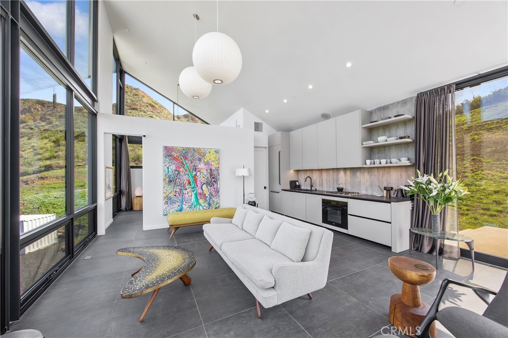 10120 Yerba Buena Road Malibu, CA 90265 - Photo 5 of 40 a living room with furniture and a large window