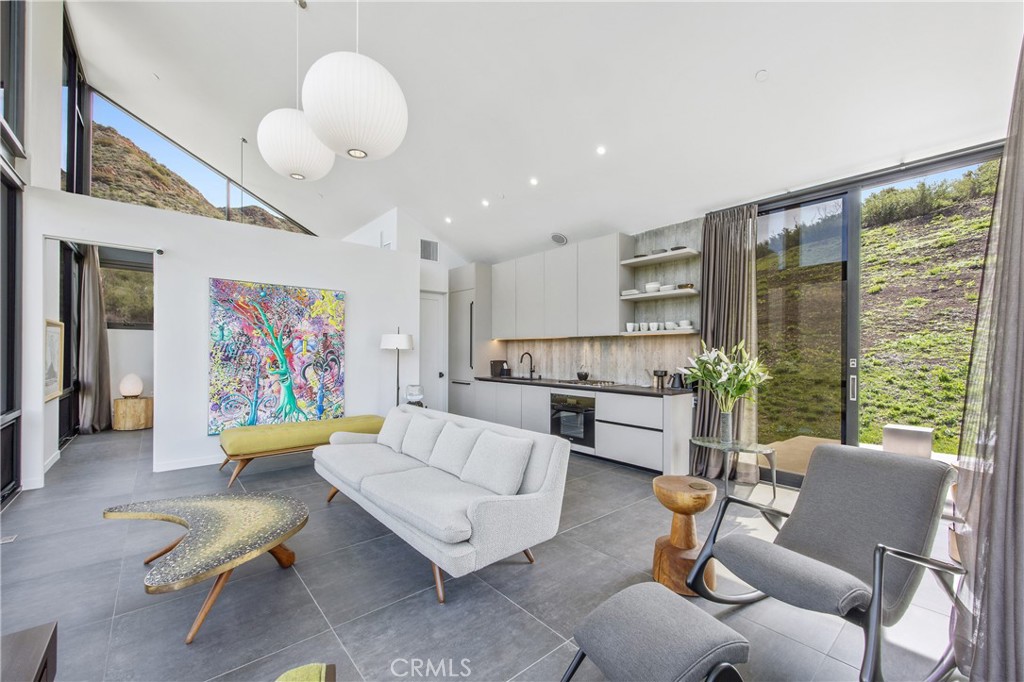 10120 Yerba Buena Road Malibu, CA 90265 - Photo 6 of 40 a living room with furniture and a large window