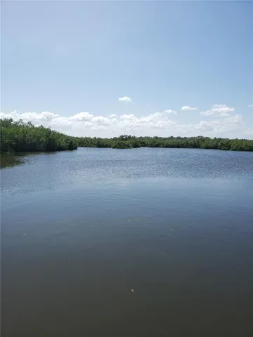 a kitchen with granite countertop a refrigerator and a stove