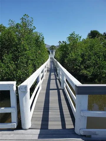 a kitchen with a sink a stove and cabinets