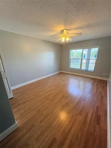 a bathroom with a sink a toilet a mirror and shower