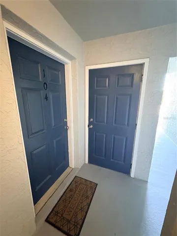 a view of a house with wooden fence