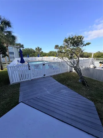 a view of a wooden deck with a bench