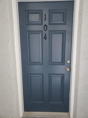 a view of a swimming pool with a yard