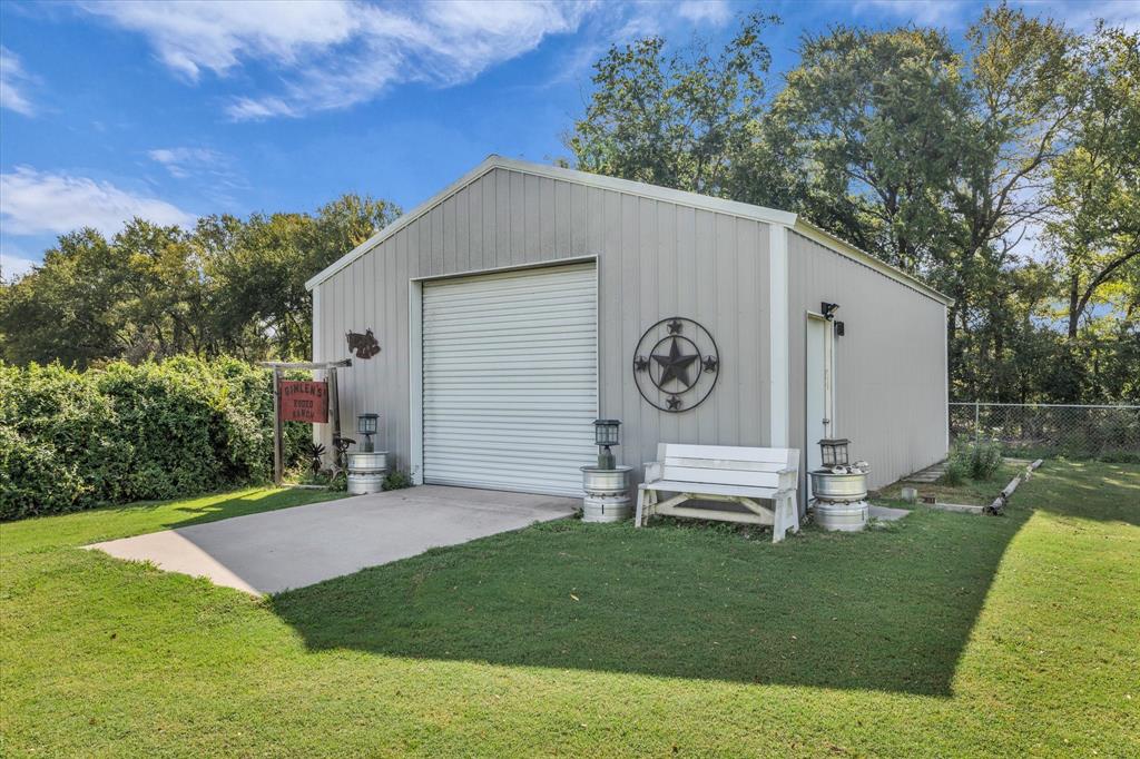 107 Fort Graham Circle Waco, TX 76705 - Photo 33 of 39 Workshop 25 X 30 with roll up door and walk in door