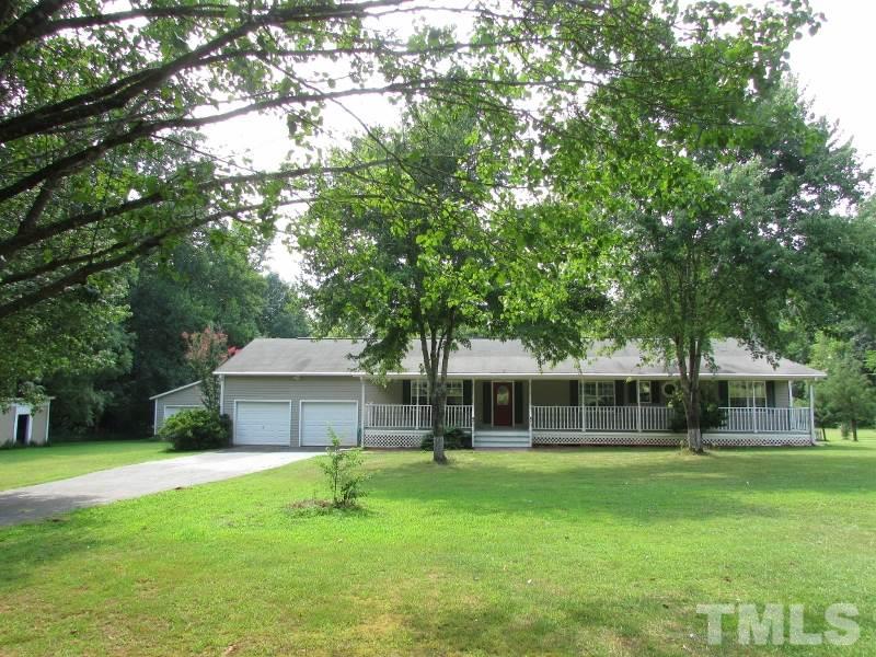 558 Robert Gentry Road Timberlake, NC 27583 - Photo 2 of 25 Nice lot, paved drive lined with bradford pear trees, 2 car garage, detached 2 car garage and a storage bldg.