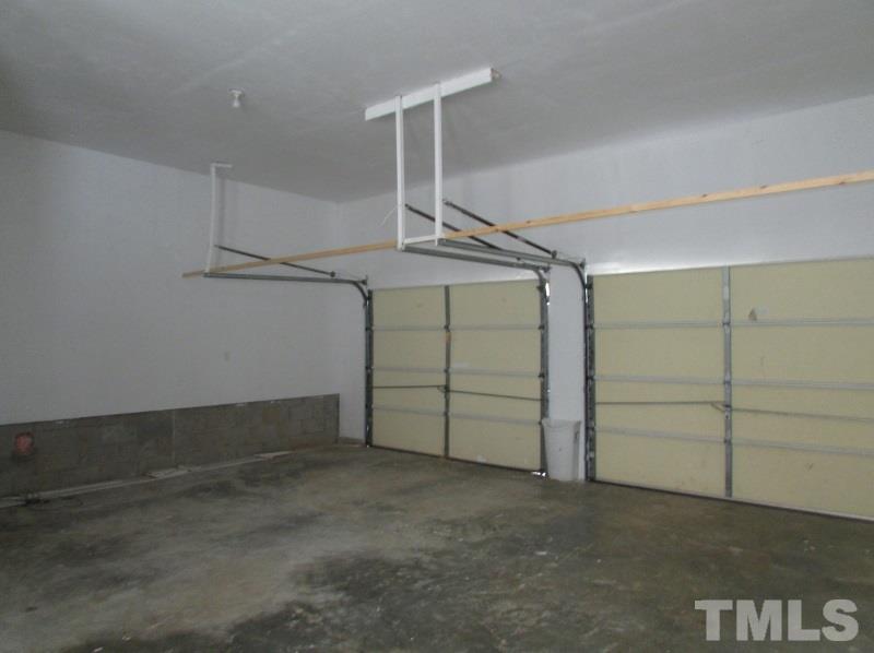 558 Robert Gentry Road Timberlake, NC 27583 - Photo 24 of 25 Interior of attached 2 car garage. Has a work area too.