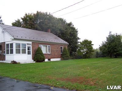 529 Jacobsburg Road Nazareth, PA 18064 - Photo 2 of 9 a view of a yard in front of a house with large windows