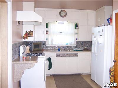 529 Jacobsburg Road Nazareth, PA 18064 - Photo 8 of 9 a kitchen with stainless steel appliances granite countertop a refrigerator and a stove