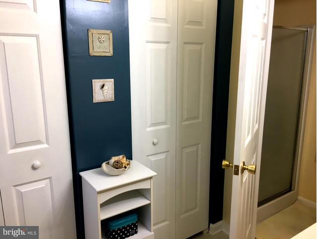 8107 Hog Neck Road Pasadena, MD 21122 - Photo 17 of 27 a bathroom with a sink and a mirror