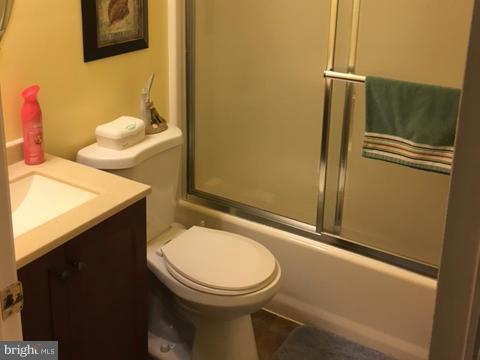 8107 Hog Neck Road Pasadena, MD 21122 - Photo 19 of 27 a bathroom with a sink and toilet